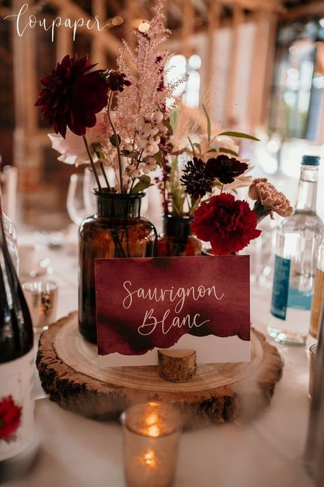 Rustic Table Names, Rust And Burgundy Wedding Table, Rustic Wedding Burgundy, Burgundy And Rust Wedding Centerpieces, Wine Theme Wedding Centerpieces, Burgundy Centerpiece Wedding, Burgundy Barn Wedding, Wedding Table Decorations Burgundy, Alternative Wedding Guest Book Ideas