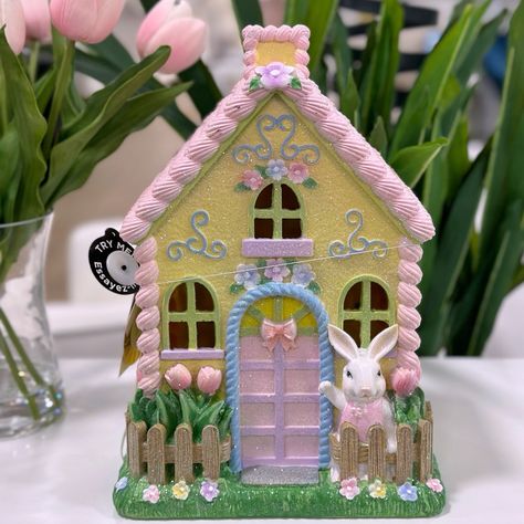 Pastel Pink And Yellow Led Light Up Easter Sugar Gingerbread House Features A Yellow And Pink Pastel Cottage Gingerbread House With Flowers, Tulips, And A Cute Easter Bunny Waving. Dimensions: Approximately 12 In H X 9 In L X 6 In W Requires 3 Aa Batteries (Not Included) Light Pink House, Cottage Gingerbread House, House With Flowers, Easter Yard Art, Pastel Pink And Yellow, Spring Village, Easter House, Pastel Cottage, Flowers Tulips