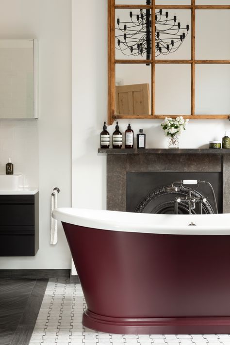 The delicious aubergine red on this freestanding boat bath is Brinjal by Farrow & Ball. Acrylic bath, custom-coloured, including base, waste and overflow, £1,571, ripplesradar.com Painted Bathtub, Bathroom With Chandelier, Dream Bathroom Design, Interior Bathroom Design, New Home Bathroom, Bathroom Chandelier, Victorian House Interiors, Glam Lighting, Luxurious Bathrooms