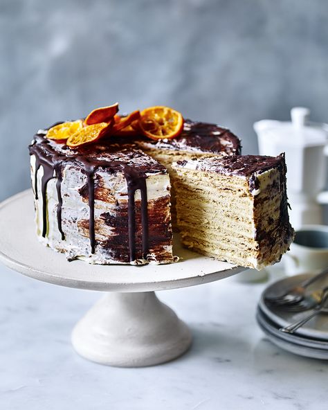 For a truly show-stopping dessert, try this Russian-inspired cake made from layered honey and orange biscuits, which have softened after soaking in the cream cheese icing. Honey Biscuit, Orange Biscuits, Gingerbread Dough, Orange Icing, Russian Cakes, Desert Ideas, Orange Frosting, Layer Cake Recipes, Delicious Magazine