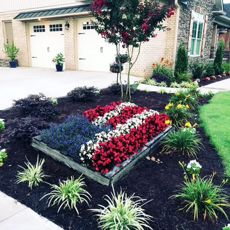 Backyard Flagpole Ideas, Driveway Entrance Flower Bed Ideas, Flower Beds Around Mailboxes, Corner Property Landscaping Ideas, Flagpole Ideas, Flowers Around House, Flag Pole Flower Bed, Landscaping Around Flagpole Front Yards, Ranch House Flower Beds