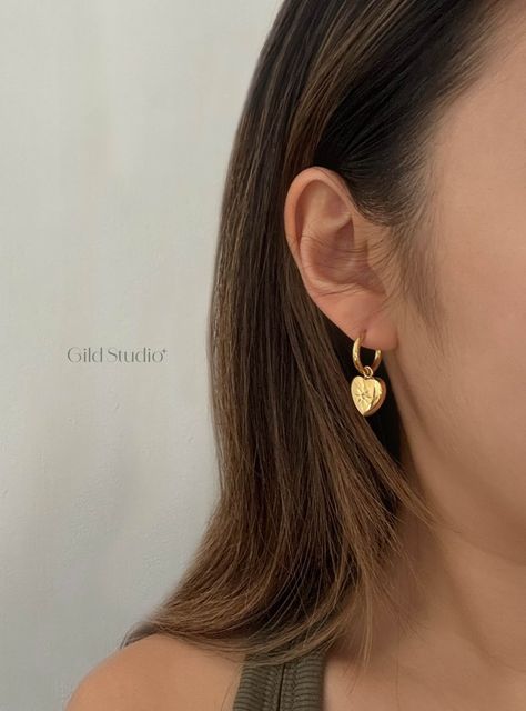 18k Gold Plated Small Heart Hoop Earrings
Length: 14mm
Width – 27mm

Gilded Treasures for Every Occasion – Crafted from high-quality stainless steel, perfect for everyday wear or special occasions.

✦ DETAILS
• Material: 18k Gold Plated, High Quality Stainless Steel
• 100% Hypoallergenic & Tarnish Resistant (Won't turn your skin green!) Gold Piercings, Dainty Gold Jewelry, Gold Heart Earring, Cute Gifts For Her, Heart Hoop Earrings, Hoop Earrings Gold, Hoops Earrings, Huggie Hoop Earrings, Small Heart