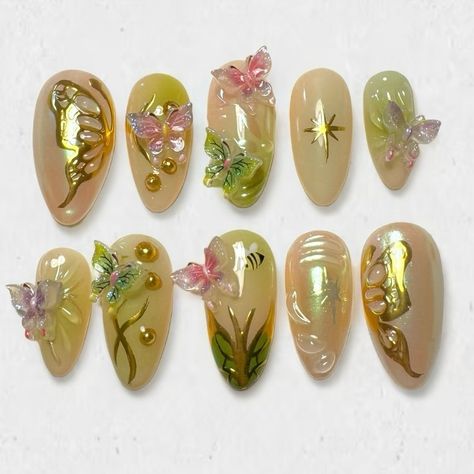 Custom butterfly garden set for @alexiskhana ☆ Prix: 70 CHF ib: @amys.clients & @get.jo.nailsdone ♡ tips are medium almond on the pic #nail #nails #pressonnails #pressons #nailextensions #stickonnails #y2knails #y2k #y2kaesthetic #y2kfashion #nailart #naildesign #naildesigns #3dnails #chromenails #greennails #butterflynails #goldnails Butterfly Garden Nails, Pink And Green Fairy Nails, Fairy Acrylics, Winx Inspired Nails, Y2k Junk Nails, Forest Fairy Nails, Butterfly Gem Nails, Pink Fairy Nails, Butterfly Nail Set