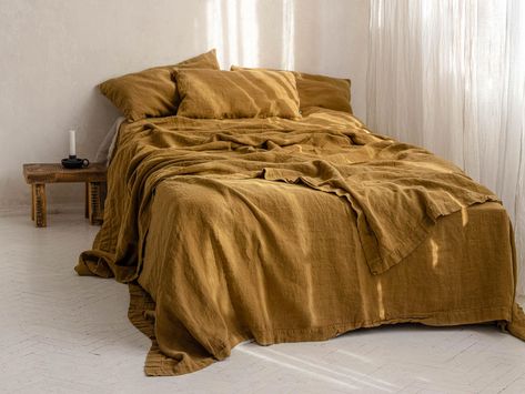 "Mustard linen bed cover, Heavyweight linen bedspread in golden ocher and other colours Fleshy while extremely soft and floaty. Ascetic simplicity and tremendous comfort of use. The coverlet is made of one piece fabric. Like all Lumio products, it was manufactured locally, in a private studio, with the usage of traditional craft techniques. Also you can use it as sofa cover  Composition: Linen 100% Size: 230x240cm // 90x95\" Care: Wash separately cold cycle. Dry in dryer on low, for a soft natural look. More lovely items: https://www.etsy.com/shop/LUMIOstudio?ref=seller-platform-mcnav" Bedroom Decor For Couples Romantic, Bedroom Decor On A Budget, Linen Bed Cover, Romantic Bedroom Decor, Linen Bedspread, Cheap Bedding Sets, Linen Bed, Bedroom Decor For Couples, Bedroom Bedding