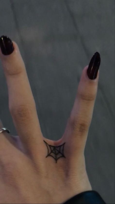 If you're looking for some inspiration for your next tattoo, or just want to see some of the most creative and well-done pieces out there, the subreddits r/tattoo and r/tattoos are the perfect places to start. Cool Simple Hand Tattoos, Small Witchy Hand Tattoos, Finger Web Tattoo, Simple Alt Tats, Small Goth Tattoo Ideas Simple, Web Finger Tattoo, Between Finger Tattoos For Women, Finger Tattoos Y2k, Finger Webbing Tattoo