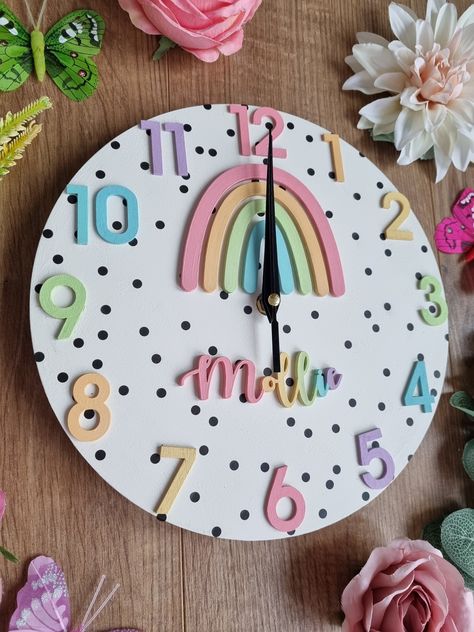 Handmade wooden rainbow clock This pretty pastel wooden rainbow clock can be personalised with wording of your choice.  It is hand painted in pretty pastel colours, backed in polka dots and lovingly assembled. This clock makes perfect decor for a rainbow themed nursery or kids room.  This wooden clock is lovingly made to order and thus colours can be changed if required. Please feel free to contact me, I am always willing to customise your order. Please note this item is not a toy and is for dec Clock Learning, Rainbow Room Decor, Dot Rainbow, Rainbow Bedroom, Big Girl Bedrooms, Rainbow Room, Wooden Rainbow, Learning Time, Rainbow Nursery