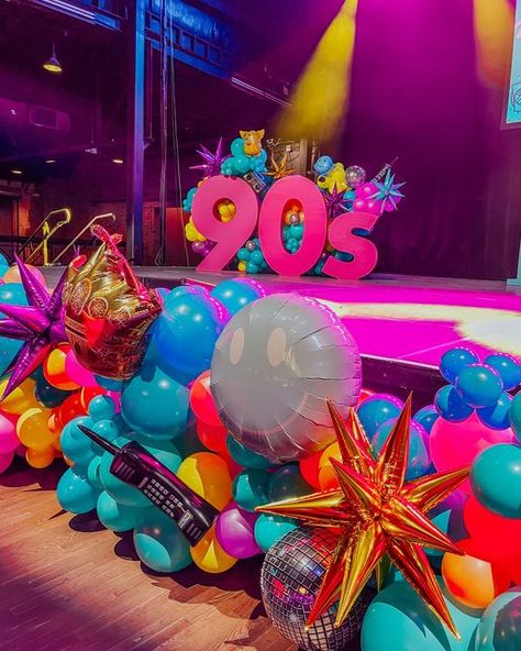 Balloon Therapy on Instagram: "welcome to the 90s 💜💖💙 #balloontherapy   Part 2 of this unforgettable 90's themed party! Stay tuned for part 3 tomorrow 😎  Special thanks to @modernpartycompany @gilleysdallas @shagcarpetprops & @glopartyandco!  • • • • • #balloongarland #dallasevents #dallasballoons #balloonartist #organicballoons #eventballoons #ballooninstallation #balloondecoration #decadesparty #80sbaby #90sbaby #90saesthetic #90sstyle #90sparty #retroaesthetic #90svintage #80saesthetic #retrothemeparty #decadestheme #throughthedecades #neonaesthetic #neonballoons #90sthemeparty #corporateevents #corporateballoons #retroballoons" 90s Decor Party, Classy 90s Party, 90s Balloons, 90s Prom Aesthetic, 90s Party Aesthetic, 90s Party Theme, Mtv Party, Balloon Therapy, 90's Theme Party