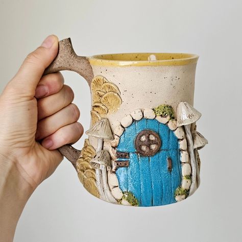 Fairy Door Mug, Hobbit House Mug, Handmade Stoneware Fantastic Mug, Mystical Gifts, One of a Kind Gift, Ceramic Beer Mug, Ceramic Mug #fairydoor #hobbithousemug #hobbithouse #handmadestonewareceramics #uniquegift #ceramicbeermug #ceramicmug #fairyhouse #cottagecore #cottagecoremug #fairymug #mushroommug #hobbitmug #handmadecoffeemug #fairyhousemug House Mug, Hobbit House, Clay Mugs, Mug Handmade, Fairy Door, Stoneware Ceramics, Mug Ceramic, Class Ideas, Fairy Houses