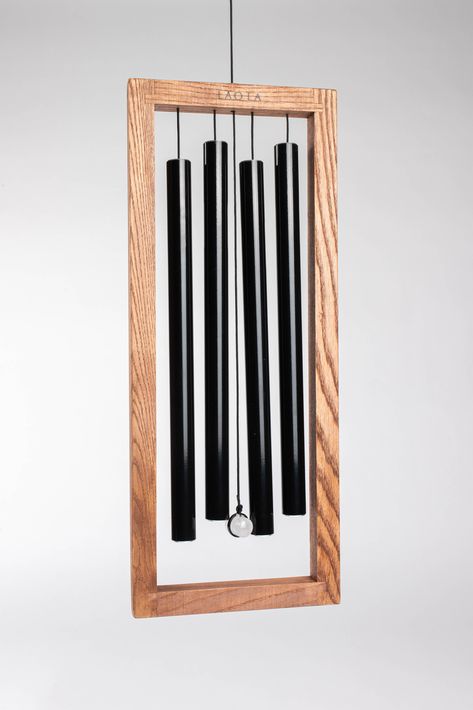 The Laurel hanging chime is the perfect way to add a touch of natural beauty to your space! Each chime is handcrafted using all five of the natural elements - fire, earth, water, metal, and wood - featuring black-coated 100% anodized aluminum tubes, an ash wood frame, and white stone. Just hang inside or outside and enjoy the flow of positive Chi! @amazonhome . . . #LAOLA #LAOLAChimes #LAOLADesign #windchime #windchimes #windchimeschiming #interiordesign #interiordesigner #interiordesignid Wood Wind Chimes, Wooden Wind Chimes, Booth Displays, Wonder Years, Booth Display, Wood Resin, Anodized Aluminum, Crafty Projects, Natural Elements