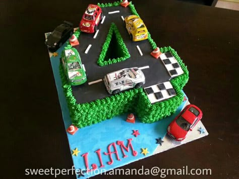 Number 4 shaped cake. Racing track cars theme. Buttercream piped grass, fondant race track & details including mini orange traffic cones.  Toy cars supplied by client. Number 4 Cake, Race Track Cake, Birthday Cake Boys, Disney Cars Cake, 4de Verjaardag, Cake Number, Race Car Cakes, Disney Cupcakes, Cars Birthday Cake