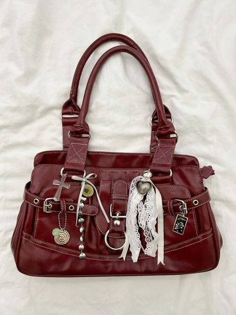 Vintage-inspired bag, gothic fashion accessory, burgundy leather aesthetic, intricate charm details, boho lace accents, cross embellishment, heart pendant style, statement purse inspiration, edgy and feminine fusion, unique bag design ideas. Brown Leather Bag Aesthetic, Everyday Bag Aesthetic, Purses Aesthetic, Fun Purses, Burgundy Handbag, Cool Bags, Aesthetic Bag, Burgundy Bag, Bag Inspiration