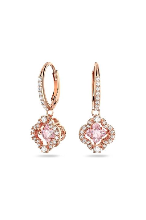 Beautiful and bright: These rose-gold tone plated Sparkling Dance pierced drop earrings combine the precision and quality of Swarovski crystals with a dazzling warm design Luxurious and elegant: This pair of pierced earrings features an alluring floral design; each piece is highlighted by a pink 'dancing' stone, beautifully complemented by clear crystal pavé Designed to last: Swarovski jewelry will maintain its brilliance over time when simple care practices are observed; remove before contact Swarovski Drop Earrings, Prom Prep, Swarovski Jewelry Earrings, Dance Earrings, Nail Bags, Rose Gold Colour, Clover Jewelry, Small Crystals, Earrings Rose Gold