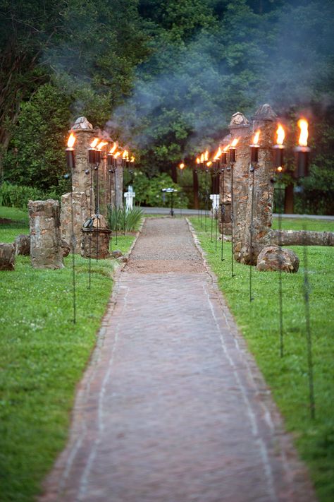 Tiki Torches    Use these torches to provide ambiance to your reception, light paths to the WC or parking areas.  Quantity: 25+  Item #: LOG009 (Stonegate Event Rentals) Tiki Torch Ideas Backyards, Torch Decoration, Luxury Restroom, Path Lighting, Outdoor Event Lighting, Fire Torch, Outdoor Torches, Citronella Oil, Vintage Tiki