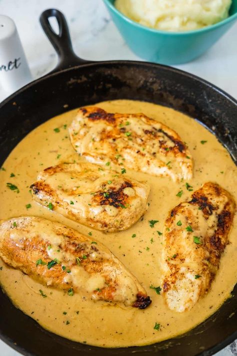 This Creamy Chicken with Mashed Potatoes has perfectly seasoned chicken breasts cooked in an amazing, rich, flavorful sauce that's made from chicken stock, cream, and a touch of Parmesan cheese! Serve it over my Perfect Mashed Potatoes and everyone will be licking their plates! This is an easy chicken dinner. Chicken With Mashed Potatoes, Chicken And Mashed Potatoes, Easy Chicken Dinner, Chicken Mashed Potatoes, Perfect Mashed Potatoes, Dinner Recipes Chicken, Seasoned Chicken, With Mashed Potatoes, Chicken Tenderloins