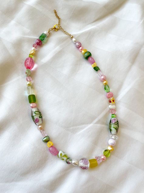 "★ The \"spring bouquet\" necklace is bright and colorful while still remaining subtle.  ★Made with lamp-worked glass beads and acrylic beads & pearls ★All necklaces come with a 2\" extension chain ★Please message me if you would like a different length"