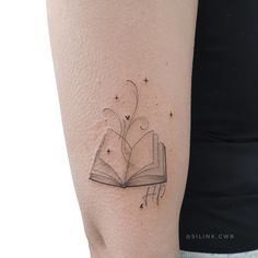 CafeMom.com : Wispy Words : 20 Beautiful Book Tattoos For Everyone's Inner Bookworm -- Here's a masterwork in lines by Sil Dobbins based in Brazil, depicting a sort of magic emanating from a book's pages. This is a theme we'll see plenty of throughout this list, but this one in its most bare state. Oh, and it's also a Harry Potter reference -- the mark of a winner. Reading Tattoo, Harry Potter References, Book Tattoos, The Giving Tree, Magic Tattoo, Burning Love, Line Work Tattoo, Ink Artwork, Book Tattoo