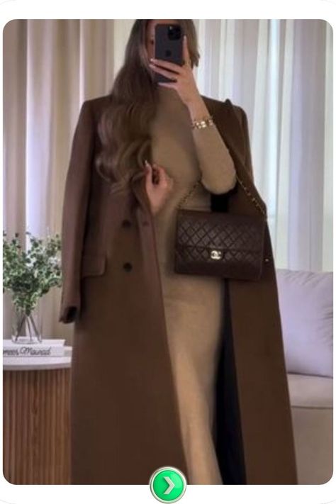 Luxe brown coat styled over a sleek black outfit. The rich brown color contrasts with the black, creating a chic, elegant look perfect for casual or formal occasions. Long Brown Coat Outfit, Coat And Dress Outfit, Coat Outfit Ideas For Women, Sleek Black Outfit, Coat Outfits For Women, Brown Coat Outfit, Coat Outfit Ideas, Long Brown Coat, Coat And Dress