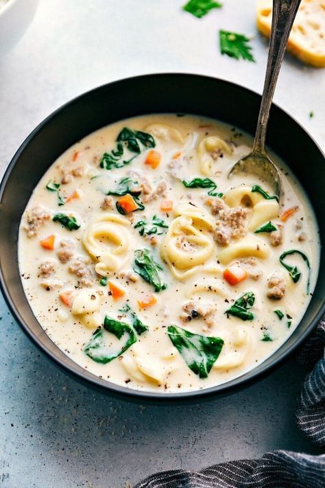 This ultra creamy and delicious cheese tortellini soup with sausage is packed with flavor -- Italian sausage, cheese-filled tortellinis, vegetables, and herbs. 30-minutes from start to finish! #soup #tortellini #sausage #dinner #healthy Slow Cooker Creamy Tortellini Soup, Creamy Sausage Tortellini Soup, Creamy Sausage Tortellini, Slow Cooker Tortellini Soup, Italian Sausage Tortellini Soup, Creamy Tortellini Soup, Creamy Tortellini, Sausage Tortellini Soup, Sausage Tortellini