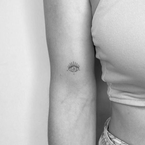 Minimalist evil eye and crescent moon tattoo on the Small Evil Eye Tattoos For Women, Devil Eye Tattoo, Evil Eye Tattoo For Women, Anatomy Eyes, Eye Tattoo On Arm, Tiny Tattoo Placement, Tattoo Bicep, Third Eye Tattoos, Future Nails