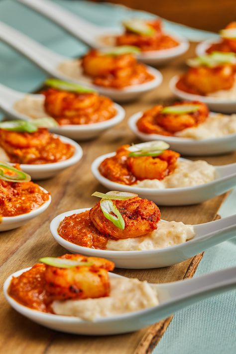 Southern event appetizer idea- shrimp and grit spoons! Plate up grits and seasoned shrimp for a taste of southern charm https://lovelessevents.com/ Catering: Loveless Events Soulfood Appetizers Wedding, Shrimp And Grits Bites, Princess And The Frog Wedding Food, Shrimp And Grits In Martini Glasses, Creole Wedding Food, Soul Food Hors D'oeuvres, Cajun Wedding Food, Shrimp Cups Appetizers, Mini Shrimp And Grits