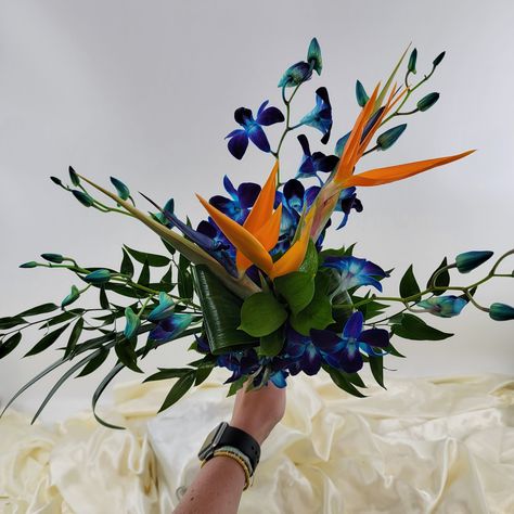 Bird of paradise, orchid, and greenery Bird Of Paradise Wedding, Tropical Bridal Bouquet, Paradise Wedding, Casket Sprays, Tropical Bridal, Orchid Bouquet, Blooming Rose, Wedding Arrangements, Bird Of Paradise