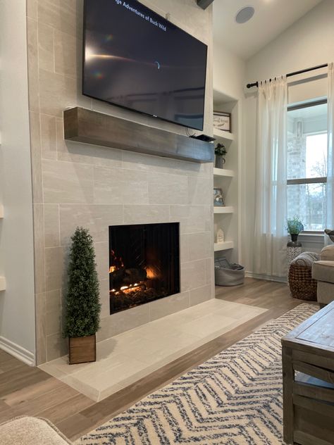 Mantle On Tile Fireplace, Modern Rustic Fireplace Tile, Modern Farmhouse Tile Fireplace, Electric Fireplace Ideas With Tile, Tile Fireplace With Wood Mantle Modern, White Tile Fireplace Wall, Farmhouse Tile Fireplace, Fireplace Wall Tile Floor To Ceiling, Linear Stone Fireplace