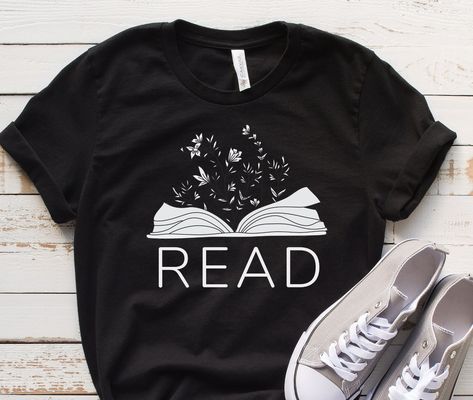 Reader Shirts, Book lover Shirts, Gift For students, Crewneck Gift Tees, Motivational Shirt, Bookworm Tees, Teacher Sweatshirt, Librarian Shirts, Unisex Gift Clothing, Reading Tshirt, Gift For Readers, Books and coffee This short sleeve tee fits like a well-loved favorite. Soft cotton and quality print make users fall in love with it over and over again. These t-shirts have-ribbed knit collars to bolster shaping. The shoulders have taping for better fit over time. Dual side seams hold the garmen Book Tshirt Design, Book Nerd Aesthetic Outfit, Reading Tshirts, Bookish Shirts, Reading Tshirt, Tee Ideas, Books And Coffee, Bookworm Shirt, Themed Shirts