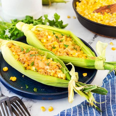 We have made this Easy Cheesy Skillet Corn for so many years. It is the perfect side dish for late summer when fresh corn season is in full swing. This corn dish has all the ingredients to make your summer sweet corn shine, like butter, cilantro, lime, and cheese. You can also serve this corn right inside the corn husk for a spectacular presentation. Plus, it is a great make-ahead dish served either in a casserole or in corn boats as in the picture. Corn Rolls, Skillet Corn, Boiled Corn, Vegetarian Fast Food, Corn Dishes, Creamy Corn, Easy Cheesy, Corn Salads, Sweet Corn