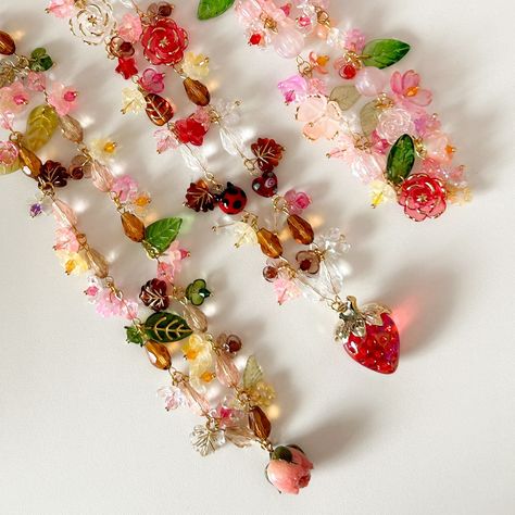 𝓻𝓸𝓼𝔂 𝓱𝓪𝓻𝓿𝓮𝓼𝓽 a garden of whimsy and wonder – one of a kind cluster necklaces crafted and designed to brighten any season. only one piece available per design! shop now on my etsy or dm to order 🫶 1. springtime serenade 2. autumn bloom 3. berry bliss #handmadewithlove #necklaces #jewelry #cottagecore #fairycore #smallbusiness Cluster Necklaces, Jewelry Cottagecore, Cottagecore Jewelry, Necklace Craft, Cluster Necklace, Necklaces Jewelry, Fairy Core, Spring Time, A Garden