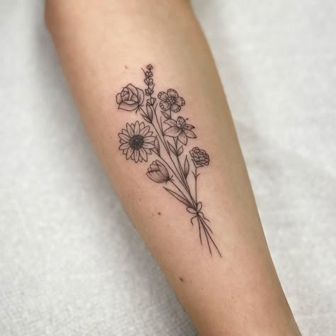 Bouquet Of 5 Flowers Tattoo, Inspirational Saying Tattoos, Tattoo Ideas Flower Bouquet, Sun Flower Bouquet Tattoo, Small Bundle Of Flowers Tattoo, Flour Bouquet Tattoo, Small Floral Bouquet Tattoo, Small Wildflower Bouquet Tattoo, Flower Bouquet Forearm Tattoo