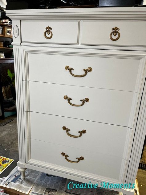 There is something about a classic warm white dresser that gives it a timeless appeal don't you think? When I purchased this ornate dresser I immediately envisioned it in this color. Everything was given a slight scuff sand and wiped clean again. Now everything is all ready to go. I don't usually paint with the drawers in but did do the first coat with them in to try it. I chose endless shore from the White Dresser With Painted Drawers, White Vintage Dresser Bedroom, Antique White Dresser, Chalkpaint Dresser White, White Painted Dressers, Rub N Buff, Matching Nightstands, Eastlake Dresser White, Off White Paints