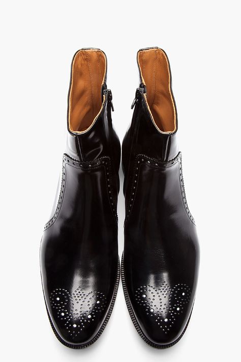 MAISON MARTIN MARGIELA //  Black Patent Leather Semi-Brogue Boots  32168M047001  Calf-high patent leather boots in black. Round toe. Perforated decoration at toe and midrow. Zip closure at inner side. Black foxing. Tonal stitching. Leather upper, leather sole. Made in Italy.  $1200 CAD Buckled Boots, Adam Gallagher, Brogue Boots, Patent Leather Boots, Best Shoes For Men, Jewelry Summer, Boots For Men, Men's Outerwear, Sharp Dressed Man