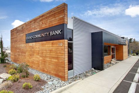 From Burger King to bank.  We stripped the abandoned fast-food building down to the slab and worked off of the existing footprint.  This high-end branch intr... Mid Century Modern Commercial Buildings, Metal Building Designs, Retail Facade, Retail Architecture, Factory Architecture, Wood Facade, Warehouse Design, Prototype Design, Bank Design