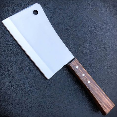 A cleaver knife! It's a super handy kitchen tool for chopping and slicing meat and veggies. It has a wide, heavy blade that makes it easier to cut through bones and tough ingredients. It's like a chef's secret weapon in the kitchen. Butchers Knife, Meat Cleaver, Doodle Frames, Cleaver Knife, Butcher Knife, Kids Only, Bead Charms Diy, Cool Swords, Santoku Knife