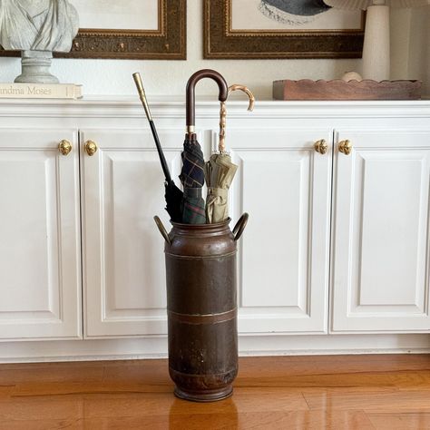 Stunning solid antique copper umbrella stand / cane holder or large vase. This piece is an aboslute treasure and is so unique. Perfect natural patina throughout. Can hold several umbrellas with ease or can be used with florals/greenery to create an eye catching arrangement.  This is an imported Dutch piece that is truly one of a kind and very difficult to find any similar styles. Expect normal signs of wear and age characteristic of antique copper/metal. Some subtle dents throughout as shown that don't affect the balance, stability or overall beauty of the piece. Overall, this piece is in incredible condition and makes a great statement piece.  This umbrella stand looks great sitting out in an entryway/foyer or in a mudroom, etc, no need to sacrifice style for function with this piece! Sta Umbrella Stand Entryway, Umbrella Holder, Sit Out, Umbrella Stands, Entryway Furniture, Copper Metal, Large Vase, Umbrella Stand, Antique Copper