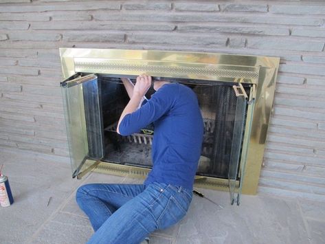 Removing the gold fireplace cover. Remove Fireplace Insert, Gold Fireplace Makeover, Removing Fireplace, Fireplace Covers, Fireplace Updates, Gold Fireplace, Propane Fireplace, Fake Fireplace, Clean Metal