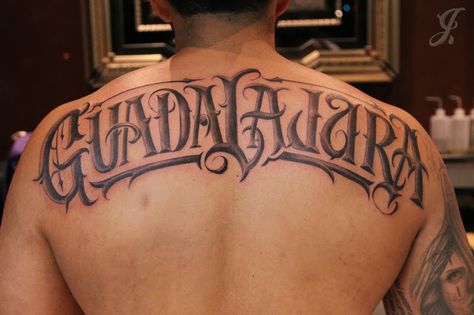 Guadalajara back tattoo by Johnny Opina Guadalajara Tattoo Ideas, Mexican Font Tattoo, Back Lettering Tattoo Men, Name On Back Tattoo, Name Back Tattoo, Tattoo Ideas Mexican, Jalisco Tattoo, Michoacan Tattoo, Small Mexican Tattoo