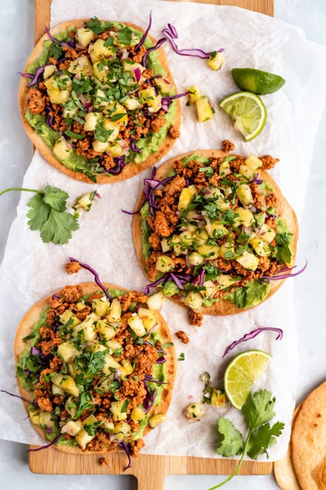 Delicious chipotle chicken tostadas topped with a colorful, fresh pineapple salsa. These healthy chicken tostadas are easy to make and have an incredible sweet and savory flavor from chipotle chicken, sweet pineapple, creamy avocado and a kick of heat from jalapeño. A fun and flavorful weeknight dinner! #tostada #chipotle #chicken #glutenfree #dinner #pineapple #salsa #tortillas Dinner Pineapple, Mango Guacamole, Chicken Tostadas, Best Cinnamon Rolls, Ambitious Kitchen, Pineapple Salsa, Chipotle Chicken, Fresh Pineapple, Low Carb Tortillas