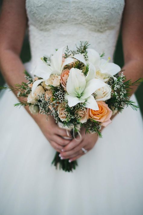 White Lily and Orange Rose Bridal Bouquet with wax flower! by Sharon Crimmings Flowers Bridal Bouquet With Lilies, Lily Wedding Bouquet, Lilly Bouquet Wedding, Stargazer Lily Bridal Bouquet, Tiger Lily Bouquet, Orange Rose Bridal Bouquet, Orange Rose Bouquet, Gypsophila Bouquet, Lily Bridal Bouquet