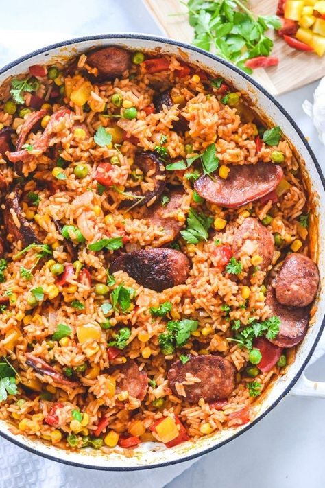 This family-friendly Spanish chorizo rice makes a healthy, filling and affordable meal that everyone will love! Made with charred chorizo sausage, capsicum and Spanish inspired spices, this hearty, flavourful dish all comes together in one pot- in less than 30 minutes! Spanish Rice With Sausage, Meals With Chorizo Sausage, Spanish Rice With Chorizo, Spanish Rice And Sausage, Pasta With Chorizo Sausage, Chorizo Rice Recipes, Chorizo And Rice Recipes, Spanish Sausage Recipes, Recipes Using Chorizo Sausage