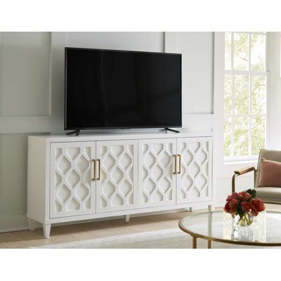 They work well as accent or entertainment cabinets with adjustable shelving and built-in wire management. These wood consoles have a raised pattern on the doors that resembles an intricate garden gate or trellis for climbing flowers. The fresh finish is accented with handles. Color: White | Wade Logan® Bekim 83" Console Table Wood in White | 37 H x 83 W x 19 D in | Wayfair Console Table Wood, Climbing Flowers, Entertainment Cabinet, Entryway Console, Wire Management, Tv Stands And Entertainment Centers, Garden Gate, Table Wood, Wood Console