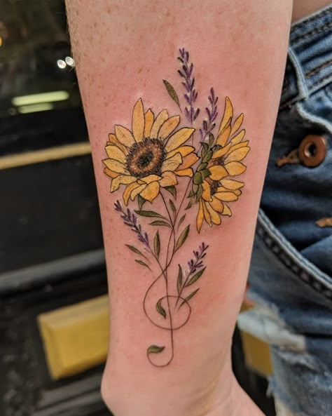 CafeMom.com : Musical Sunflower : 20 Cheery Sunflower Tattoos That Are Floral Done Right -- This is an interesting concept for a sunflower tattoo, making the flower's stem appear like a music note toward its bottom. With that, it combines love of things both musical and floral, and the wispy line work imparts a serious sense of realism on the piece. Kudos to Philadelphia artist Robert Kraiza for this lovely piece. Music Memorial Tattoo, Larkspur Tattoo, Music Notes Tattoo, Music Note Tattoo, Music Tattoo Designs, Note Tattoo, Sunflower Tattoos, Memorial Tattoo, Line Art Tattoos