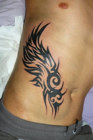 Rib Cage Tattoo Ideas for Guys Jing Y Jang, 21 Tattoo, Stammestattoo Designs, Tattoo Colors, Rib Tattoos For Guys, Wing Tattoo Men, Ribcage Tattoo, Wing Tattoo Designs, Wing Tattoo