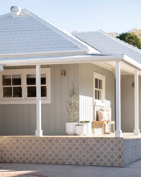 The vertical cladding, trims, eaves and wide window trims used a fresh lick of Dulux Pozieres and Dulux White Dune paint to bring this exterior to life. Weatherboard House, Roof Restoration, Porch Tile, Three Birds Renovations, Pintura Exterior, Cottage Renovation, Three Birds, Exterior Color Schemes, Contemporary Cottage