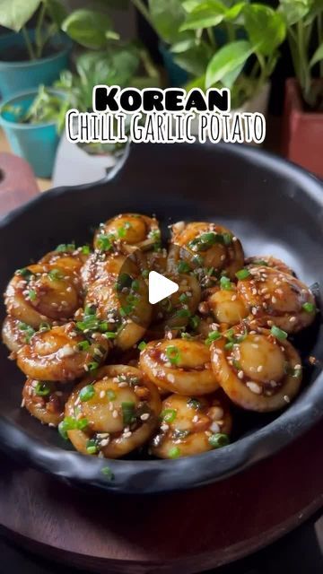 Asian Food | Recipes | Cooking on Instagram: "Korean Chilli Garlic Potatoes✨️⁣ 🎥 & recipe by @myflavourfuljourney ©️⁣ ⁣ ➡️ Follow @asianfoodsdaily for more asian meal inspo!👌⁣ ⁣ ✅Recipe details below 👇⁣ ⁣ Boil 3 medium sized potatoes⁣ Then mash them very well⁣ Now add 1/2 cup cornflour/potato starch⁣ Knead the dough very well⁣ Now make small round balls and give mushroom liked shape with bottle⁣ Now boil them for 2-3 minutes until they float on top of the water⁣ Immediately transfer them into ice cold water⁣ ⁣ For the sauce add lot of chopped garlic,chopped spring onions,red chilli powder,soy sauce,sesame seeds in a bowl and pour some hot oil⁣ Mix the sauce and add potato buttons⁣ Toss them nicely in the sauce⁣ Garnish with some more spring onions and sesame seeds on top⁣ And Enjoy!⁣ ⁣ Soy Sauce Potatoes, Korean Mashed Potatoes, Viral Potato Recipe, Korean Potato Recipes, Chilli Potato Recipes, Jacked Potatoes, Boiled Potatoes Recipe, Potato Mushroom Recipe, Garlic Potatoes Recipe