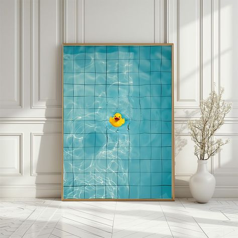 Add a splash of fun and whimsy to your space with this vibrant AI-generated art print featuring a cheerful yellow rubber duck floating in a serene blue swimming pool. The minimalist composition captures the playful essence of summer with the duck's bright yellow color contrasting beautifully against the clear blue water. This digital download is perfect for adding a touch of joy and simplicity to any room, making it an ideal choice for modern home decor, children's rooms, or even as a unique piece of bathroom art. Enjoy the lighthearted charm of this floating rubber duck print and bring a bit of summer fun into your home all year round. Please note this is a high resolution instant digital download for printable artwork.  DIGITAL DOWNLOAD ONLY NO ITEM WILL BE SHIPPED Colorful Poster Prints, Yellow Blue Bathroom, Modern Art Bathroom, Blue Yellow Bathroom, Ducks Art, Art For The Bathroom, Children Bathroom, Blue And Yellow Bathroom, Fun Artwork