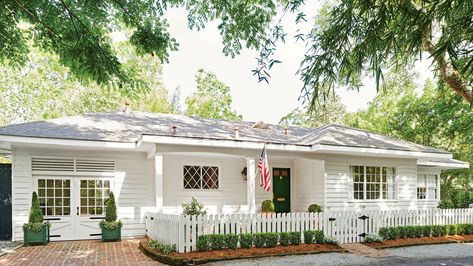 After | New Orleans designer Shaun Smith gives a 1950s ranch a farmhouse persona with a few key updates. White Ranch Style House, Ranch Style Homes Exterior Remodel, 1950s Ranch Remodel, White Ranch House, Ranch Style Homes Exterior, Ranch Exterior Remodel, Rambler House, Brick Ranch Houses, Ranch House Remodel