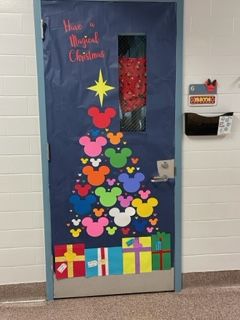 Disney Holiday Classroom Door, Disney Door Decorations Christmas, Disney Christmas Hallway Decorations, Disney Hotel Door Decorations, Disney Christmas Door Decor For School, Mickey Mouse Christmas Door Decorations, Disney Christmas Bulletin Boards, Disney Christmas Classroom Door Ideas, Disney Christmas Door Decorations