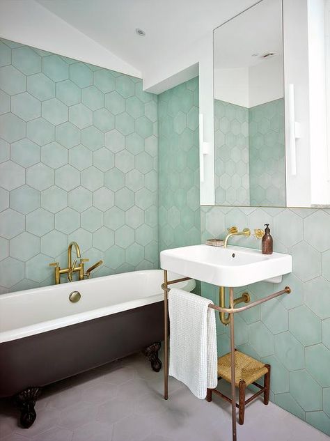 Contemporary bathroom boasting green hexagon wall tiles encompasses a black clawfoot bathtub paired with an antique brass floor mount tub filler. Green Hexagon Tile, Hexagon Bathroom, Hexagon Tile Bathroom, Hexagonal Tiles, Green Tile Bathroom, Hexagon Tile, Inspiration Bathroom, Bad Inspiration, Baddie Nails