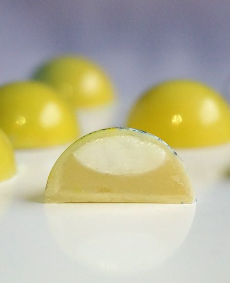 Chocolate filled with vanilla marshmallow and zingy lemon and white chocolate ganache Bonbon Filling Recipe, Dome Desserts, Lemon And White Chocolate, Bonbons Recipe, Chocolate Suckers, Chocolate Bonbons Recipe, Jar Watercolor, Sponge Candy, Chocolate Bon Bons